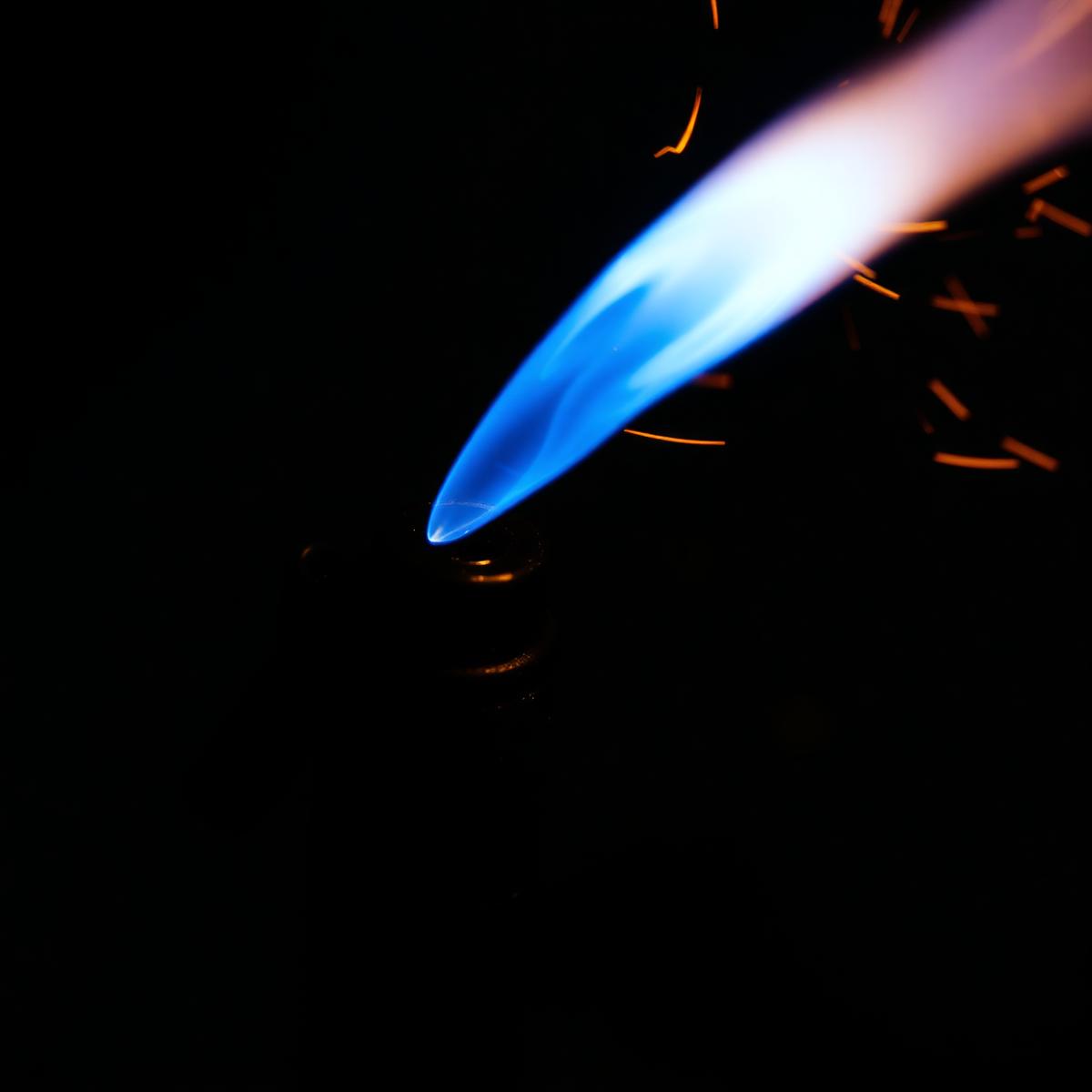 Close-up of the Pocket Flame Lighter's windproof blue butane jet